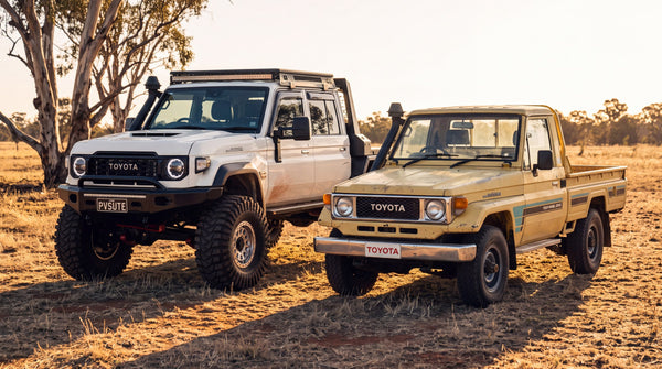 An early LandCruiser 70 Series in faded paint beside a current model 70 Series ute
