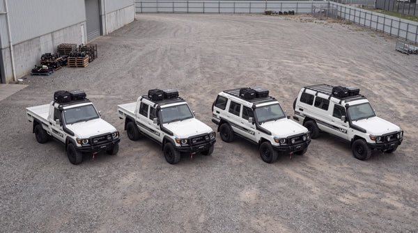 Four LandCruiser 70 Series body styles lined up: single cab, dual cab, wagon and Troopcarrier