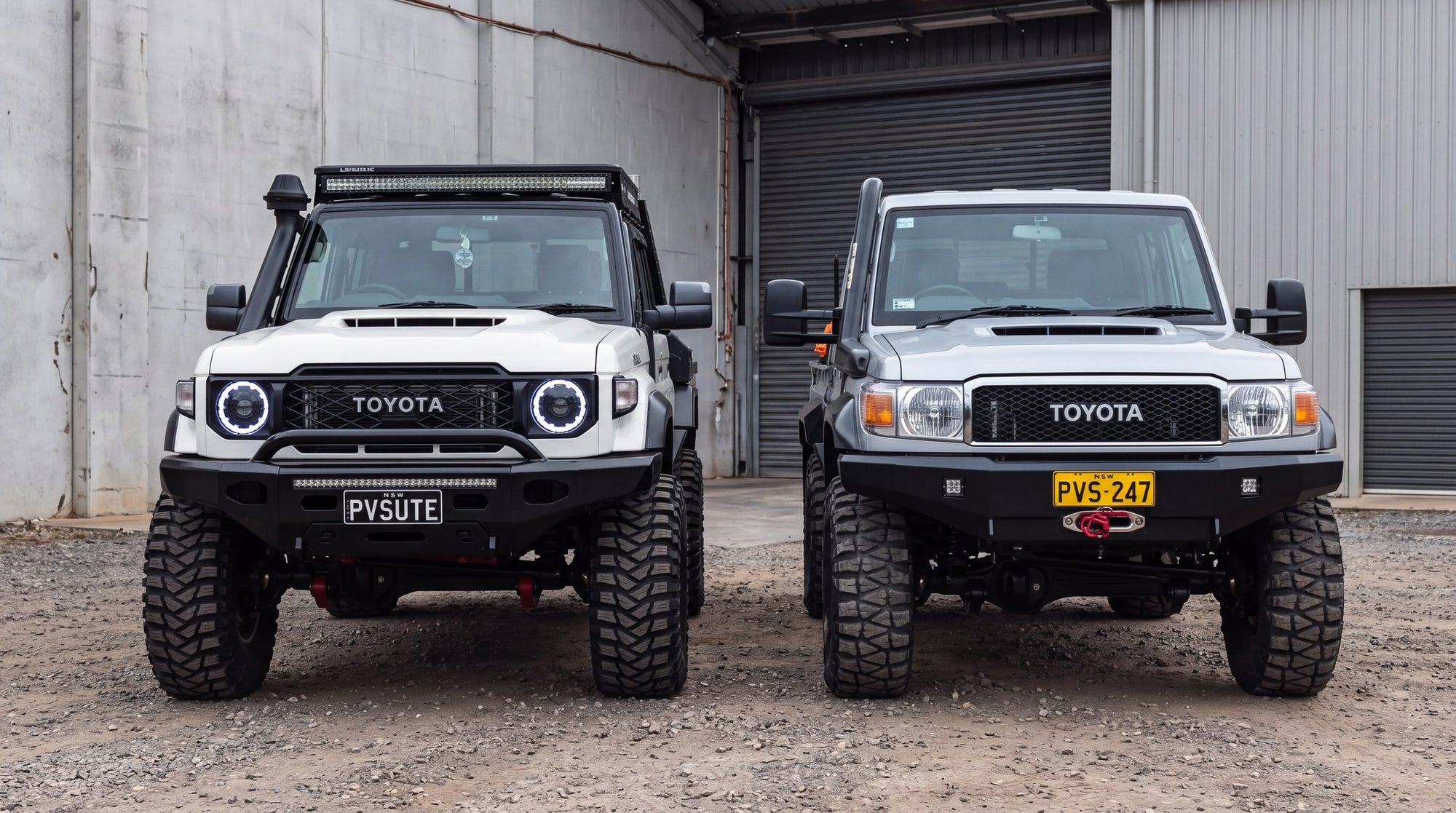 Two Toyota LandCruiser 70 Series utes side by side, older round headlight front end beside the newer squared one