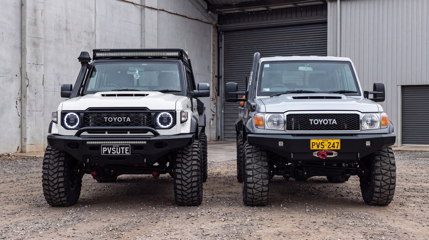 Two Toyota LandCruiser 70 Series utes side by side, older round headlight front end beside the newer squared one