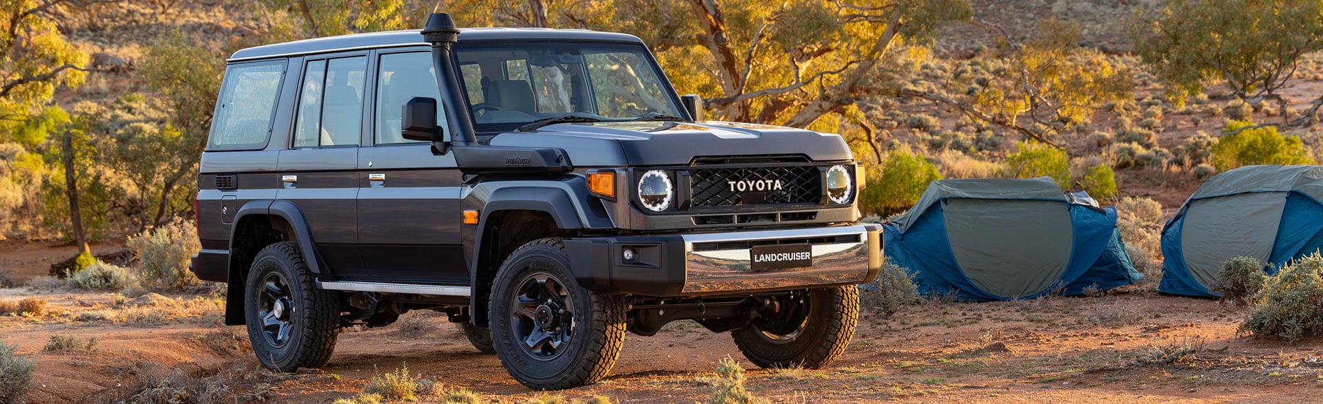 Factory Toyota LandCruiser 70 Series GXL wagon at a bush campsite