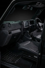 Black leather dashboard upgrade fitted in a Toyota 76 Series LandCruiser, full cockpit view