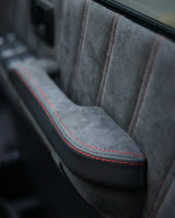 THE GOVNER 79 Series build: Alcantara door armrest detail with red stitching